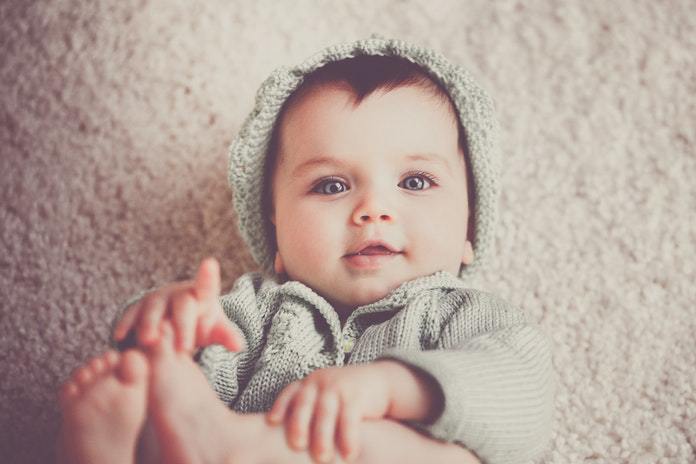 baby playing with toes