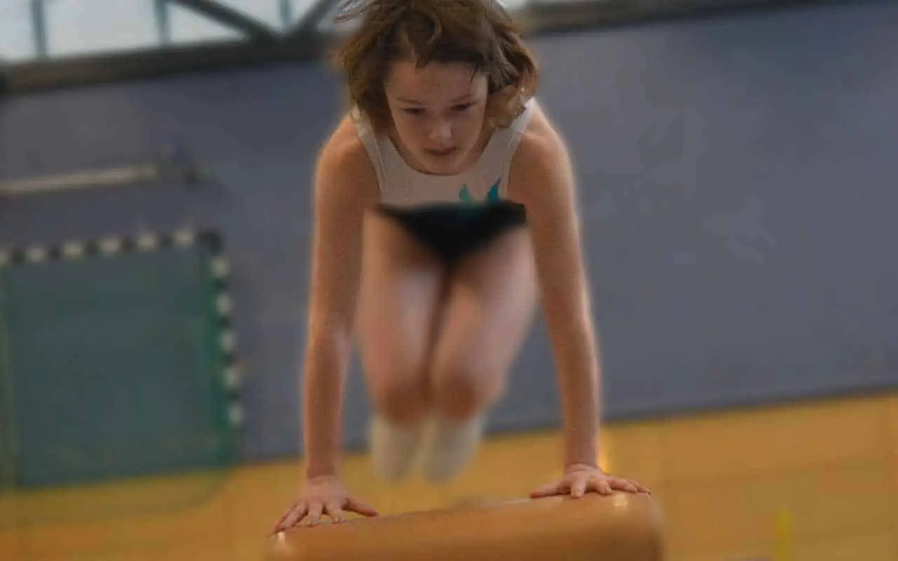 girl on gymnastics beam