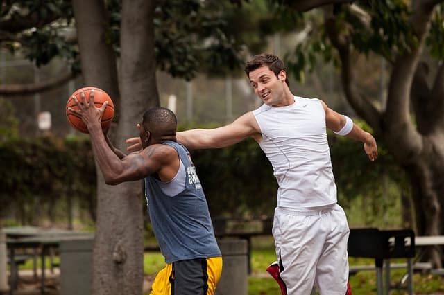 friends playing basketball