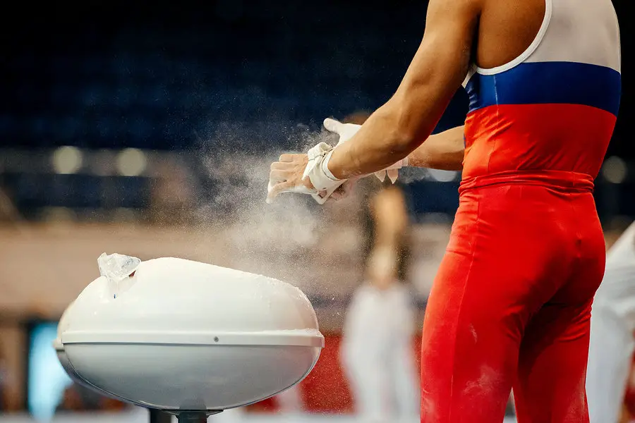 gymnast taking care of hands