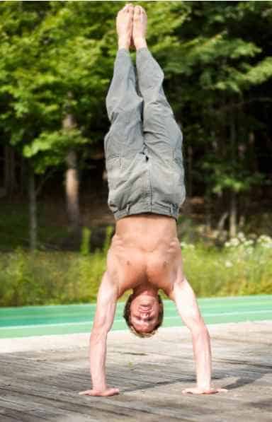 man performing a handstand