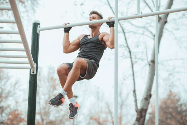 man wearing monkey bar gloves